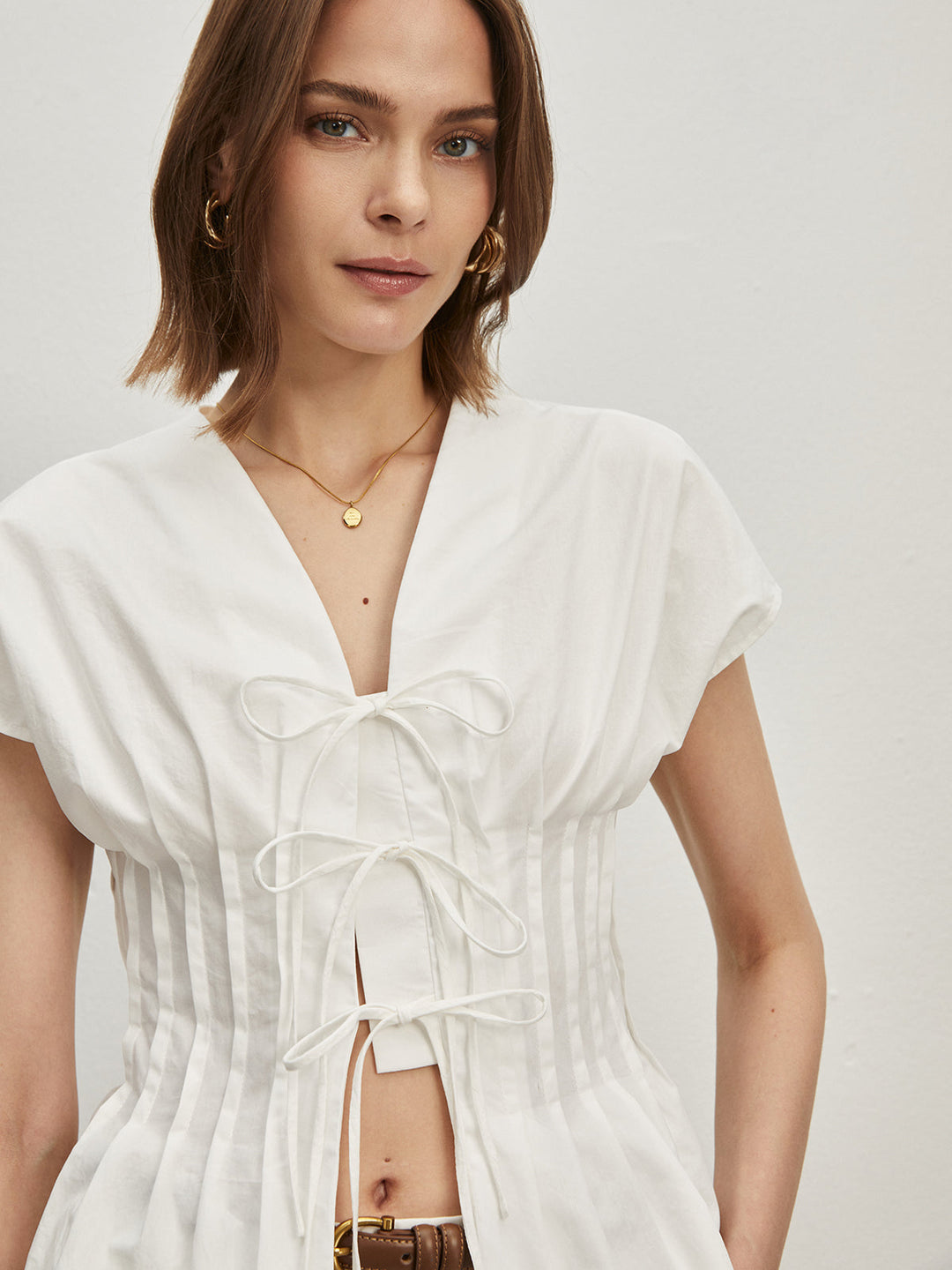Baumwoll-Falten-Bluse mit Knoten