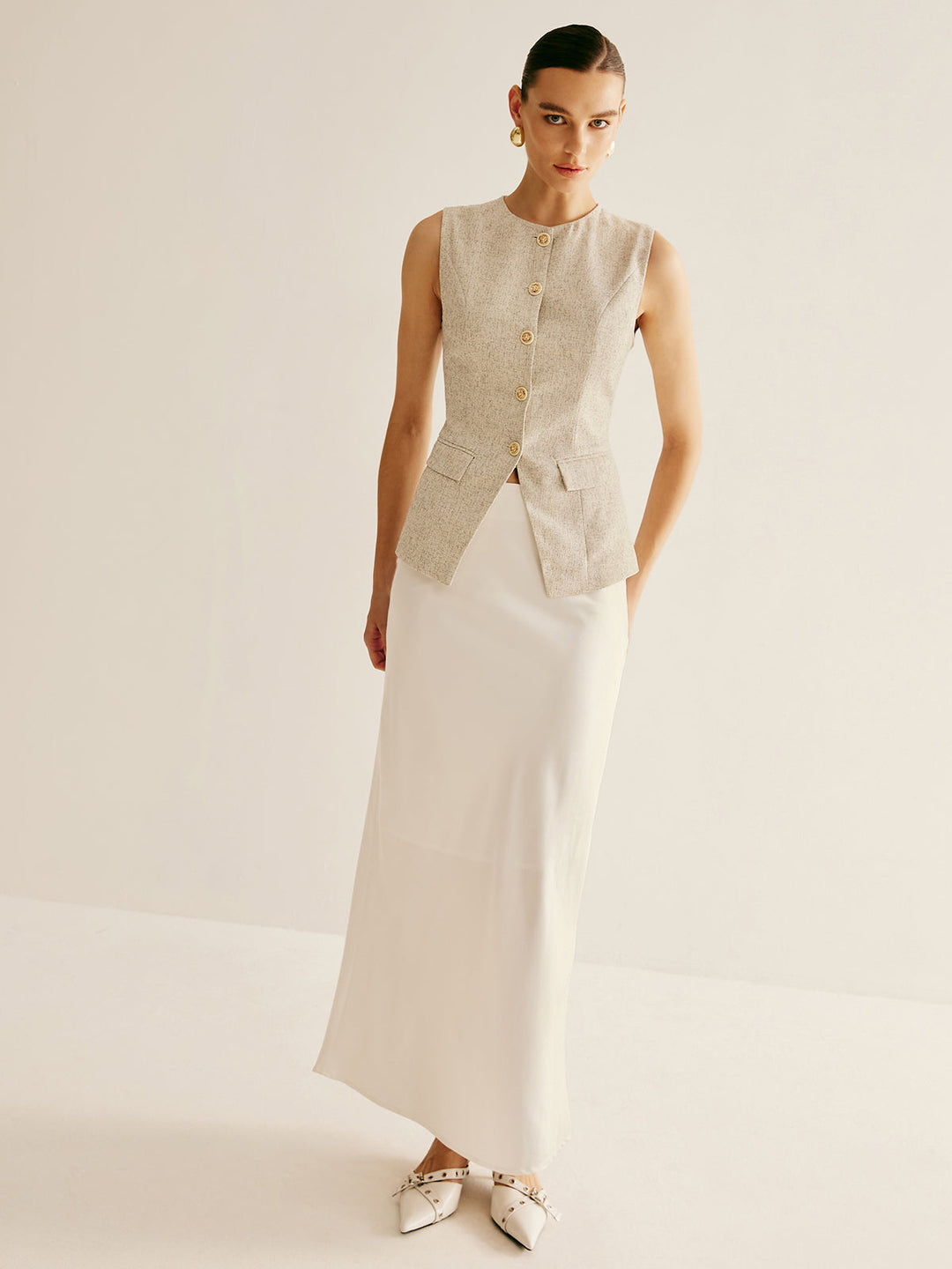 Elegante Weste mit durchbrochenen Hosenträgern und geteiltem Saum