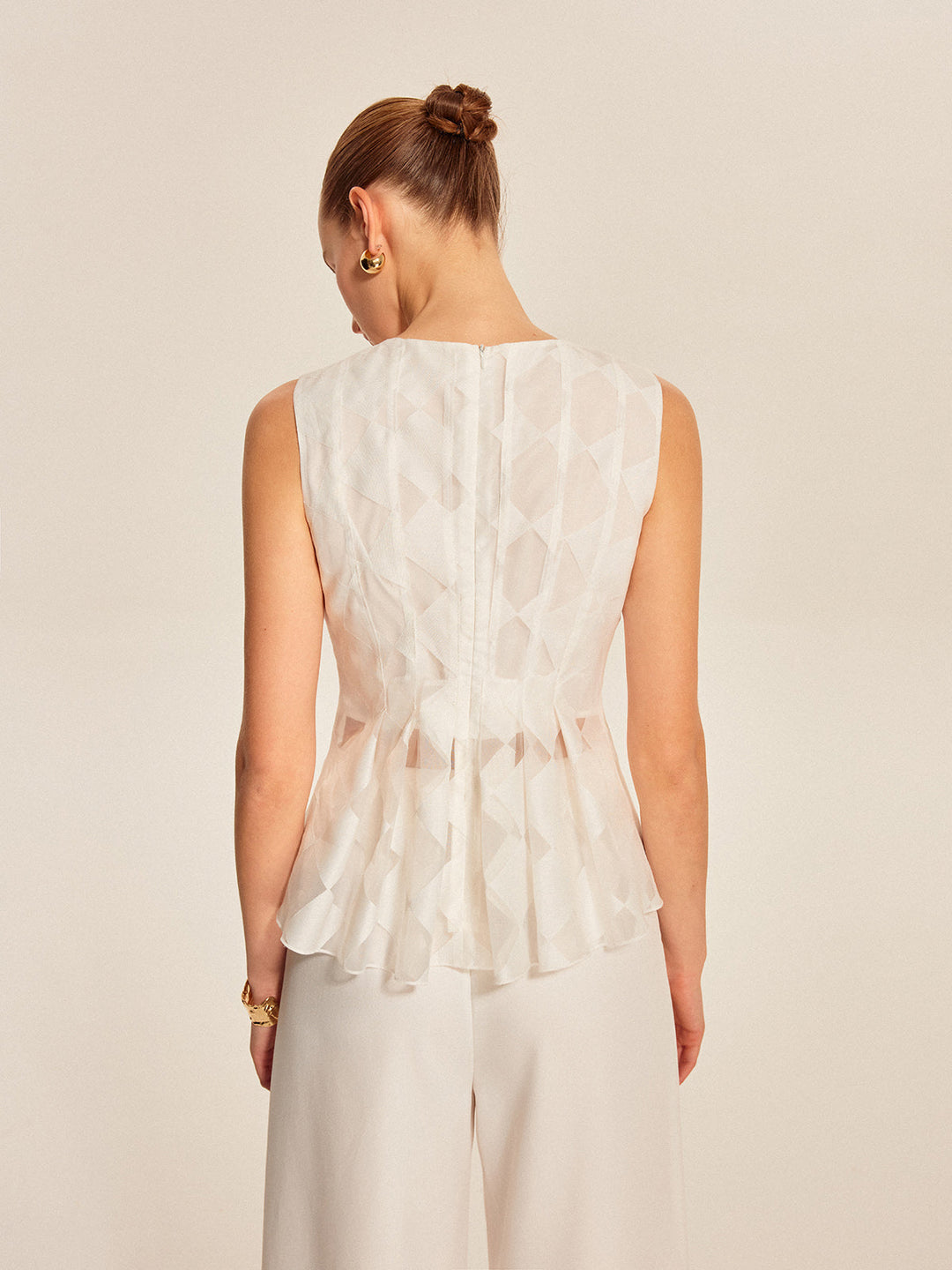 Halbtransparente geometrische Schößchenbluse
