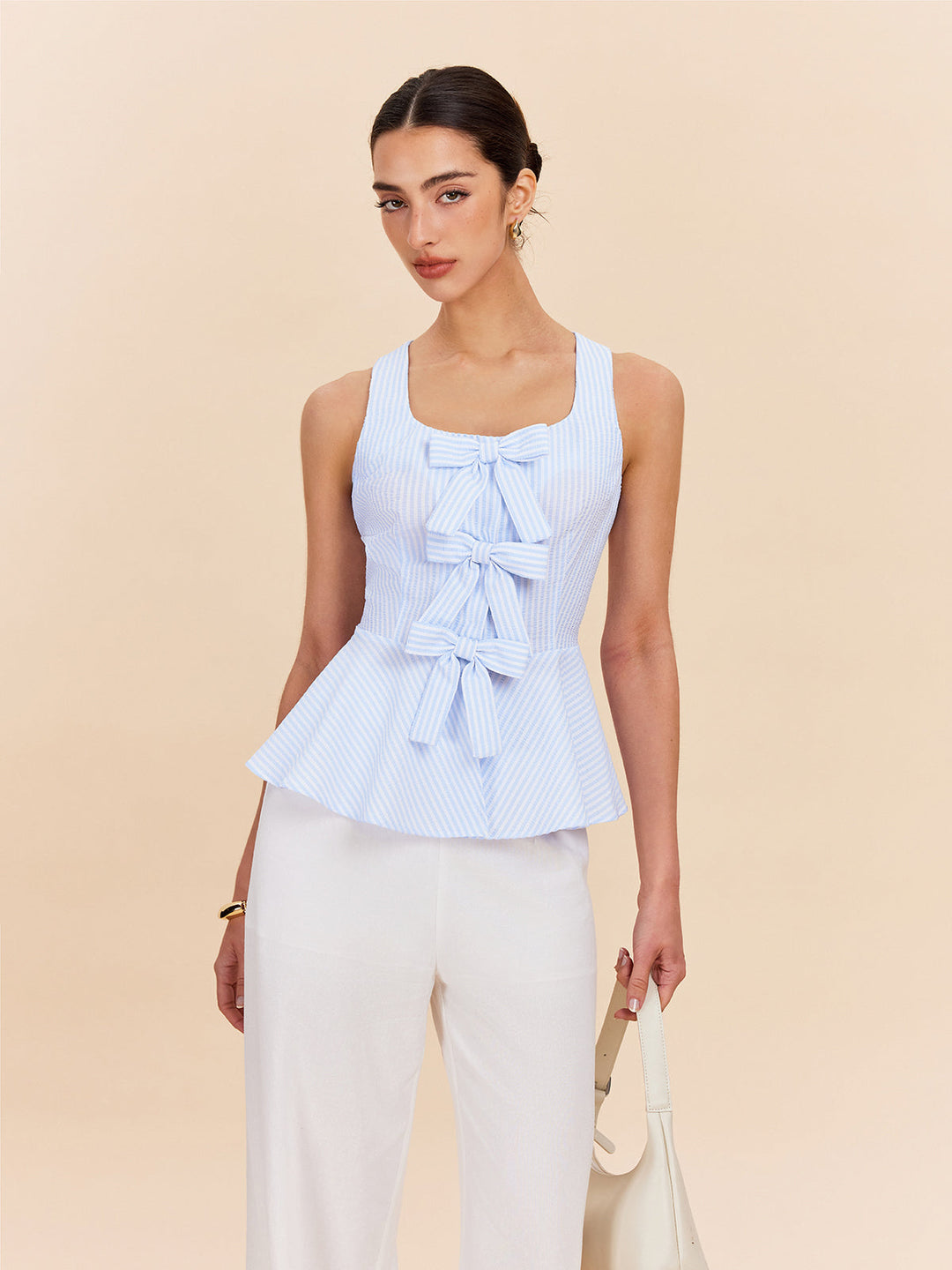 Gestreifte Schößchenbluse mit Schleifendetails