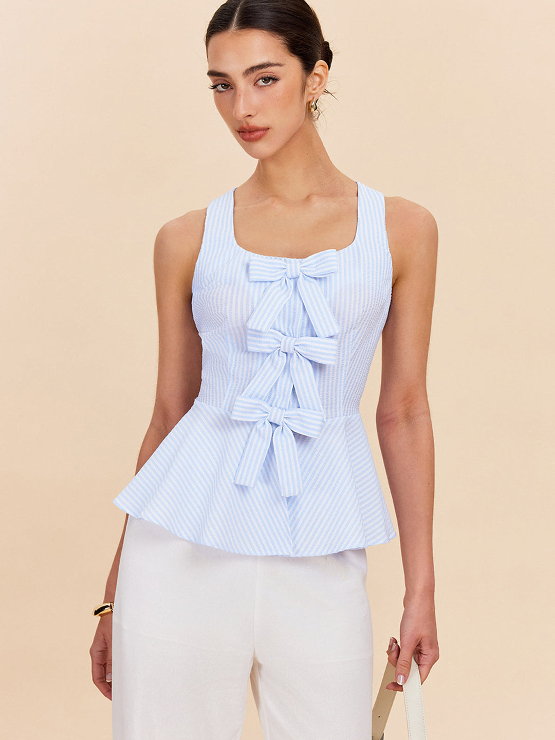 Gestreifte Schößchenbluse mit Schleifendetails