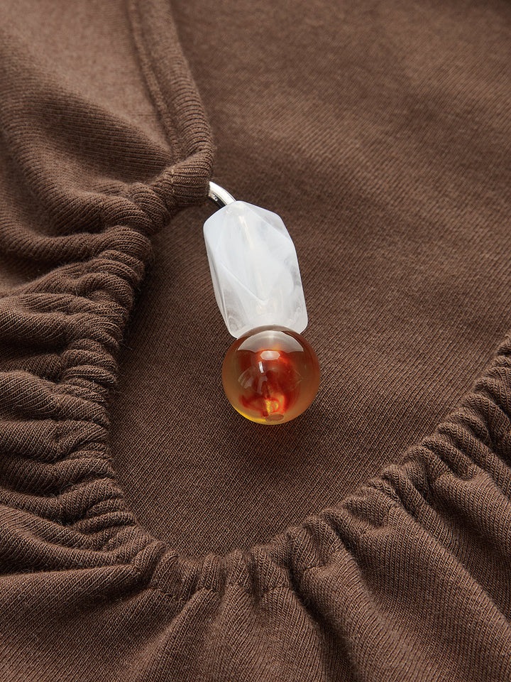 Asymmetrisches Wickeltop mit Knopfdetail