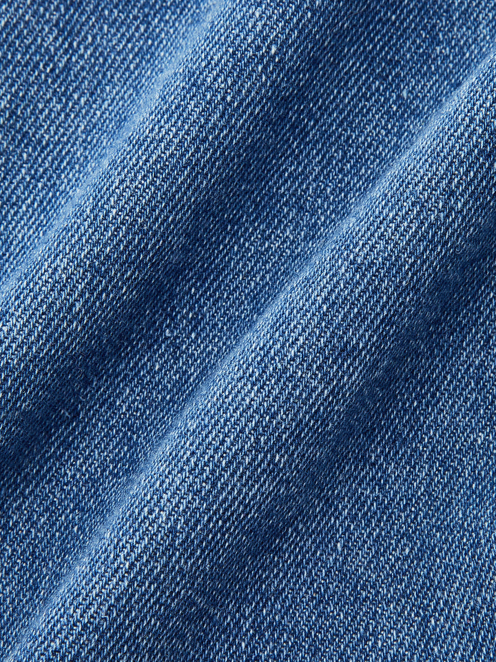 Taschenrock aus asymmetrischem Denim