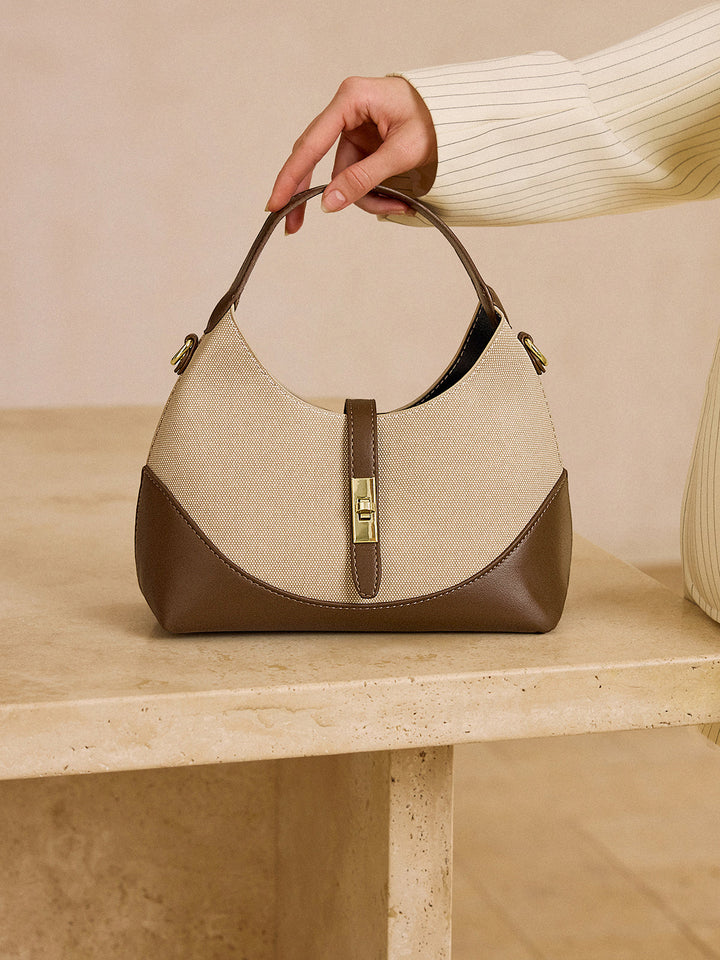 Tasche in Farbblock-Optik in Knödelform mit Metallverschluss